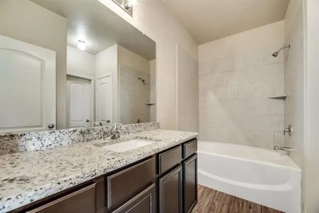 220 Aaron St, Anna, TX 75409 - bathroom with vanity, wood finished floors, and shower / washtub combination