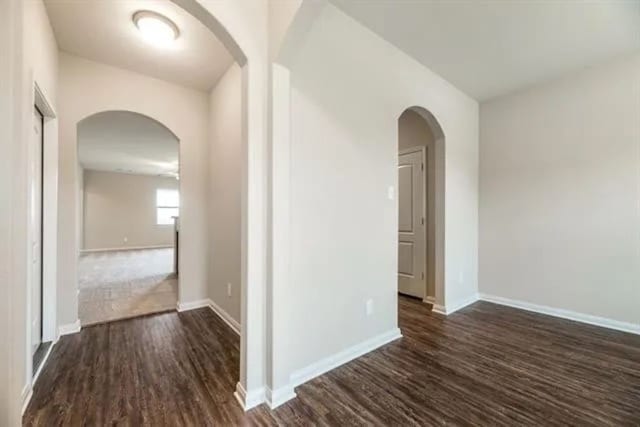 220 Aaron St, Anna, TX 75409 - hallway with dark wood-style floors and arched walkways