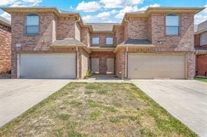 5729 Blackmon Ct, Fort Worth, TX 76137 - view of front of house featuring an attached garage, concrete driveway, and brick siding