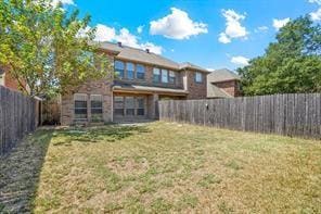 5729 Blackmon Ct, Fort Worth, TX 76137 - rear view of property with a fenced backyard
