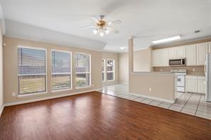 5729 Blackmon Ct, Fort Worth, TX 76137 - unfurnished living room featuring ceiling fan and light wood finished floors