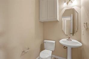 5729 Blackmon Ct, Fort Worth, TX 76137 - half bath featuring toilet and baseboards