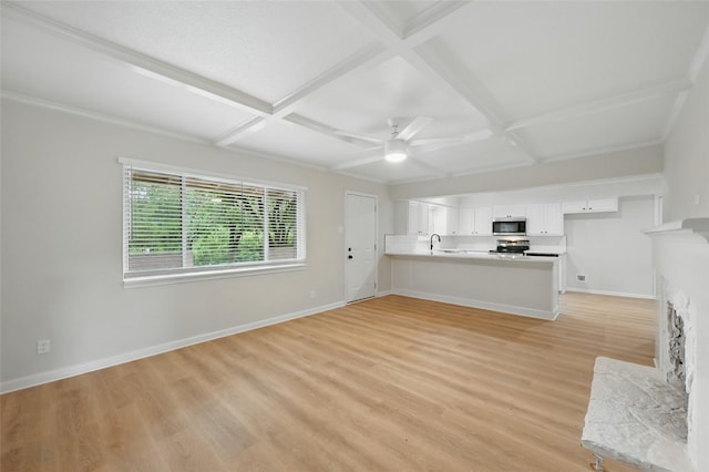 2705 Shelby St, Garland, TX 75041 - unfurnished living room featuring coffered ceiling, a ceiling fan, light wood-type flooring, and beamed ceiling