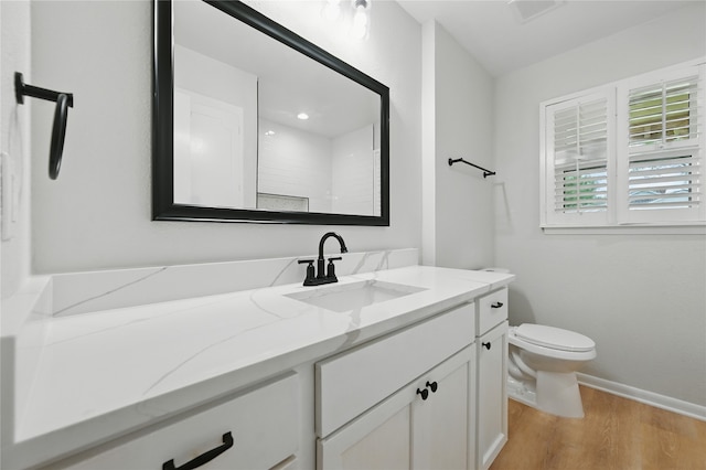 2705 Shelby St, Garland, TX 75041 - bathroom featuring vanity and wood finished floors