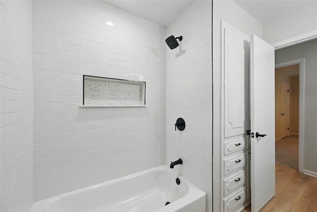 2705 Shelby St, Garland, TX 75041 - bathroom featuring wood finished floors and shower / tub combination