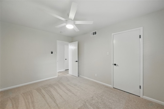 2705 Shelby St, Garland, TX 75041 - unfurnished bedroom with light carpet and a ceiling fan