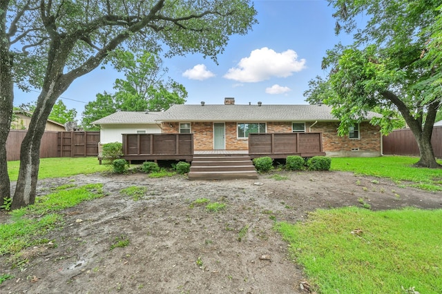 2705 Shelby St, Garland, TX 75041 - ranch-style house with a fenced backyard, a wooden deck, and brick siding