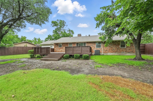 2705 Shelby St, Garland, TX 75041 - back of property featuring a fenced backyard, brick siding, a chimney, and a wooden deck