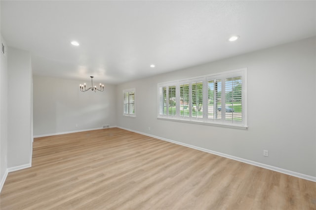 2705 Shelby St, Garland, TX 75041 - unfurnished room with a chandelier, light wood-type flooring, and recessed lighting