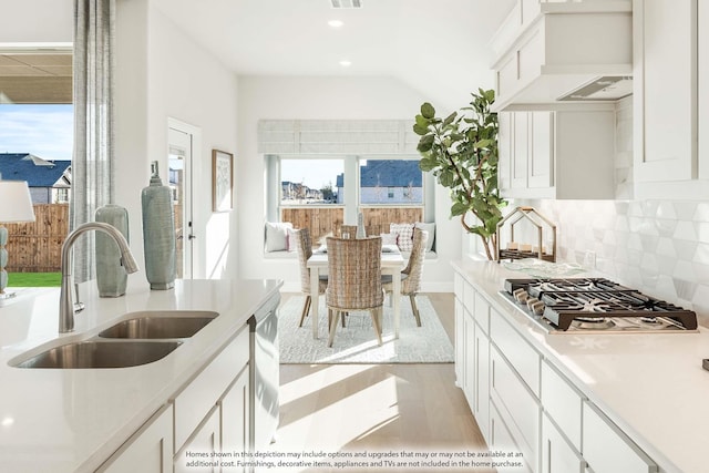 3803 Hidden Cove Ct, Rockwall, TX 75032 - kitchen featuring stainless steel gas stovetop, backsplash, white cabinets, light countertops, and recessed lighting