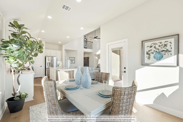 3803 Hidden Cove Ct, Rockwall, TX 75032 - dining space with light wood-type flooring, ceiling fan, recessed lighting, and high vaulted ceiling