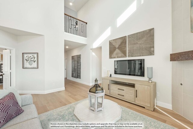 3803 Hidden Cove Ct, Rockwall, TX 75032 - living area with wood finished floors and a high ceiling