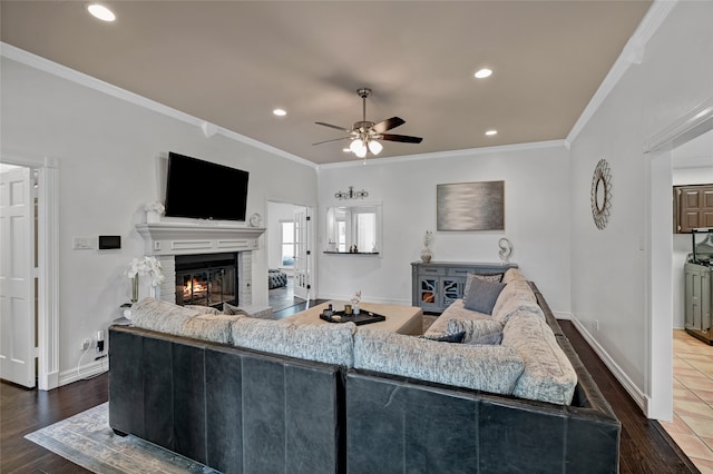 2900 Trail Lake Dr, Grapevine, TX 76051 - living room with ornamental molding, ceiling fan, a glass covered fireplace, dark wood finished floors, and recessed lighting