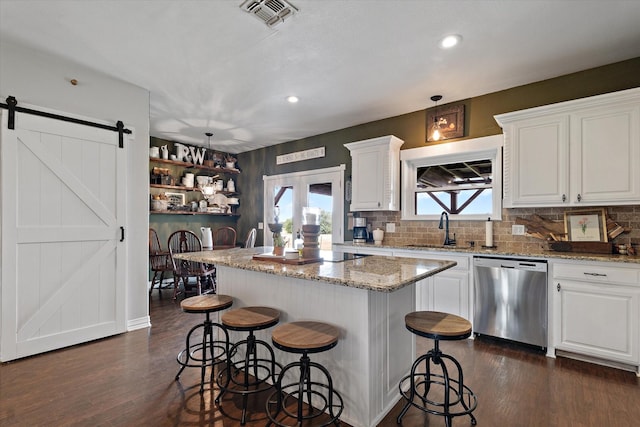 5885 State Highway 160, Whitewright, TX 75491 - kitchen featuring stainless steel dishwasher, dark wood-style flooring, decorative backsplash, white cabinets, and recessed lighting