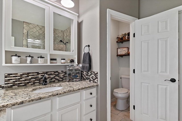 5885 State Highway 160, Whitewright, TX 75491 - bathroom featuring backsplash, vanity, a tile shower, and tile patterned flooring