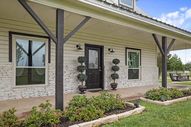 5885 State Highway 160, Whitewright, TX 75491 - view of exterior entry featuring covered porch
