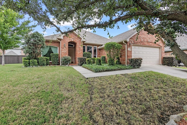 2009 Lake Fork Ct, Denton, TX 76210 - view of front of house featuring brick siding, concrete driveway, a garage, and roof with shingles