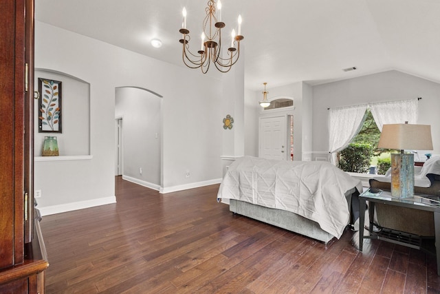 2009 Lake Fork Ct, Denton, TX 76210 - bedroom featuring arched walkways, wood finished floors, a chandelier, and vaulted ceiling