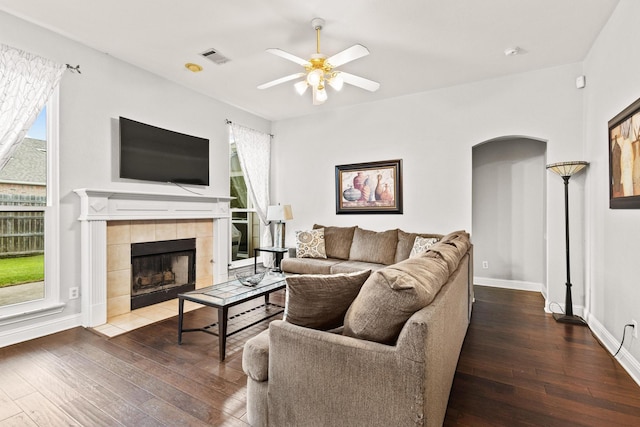 2009 Lake Fork Ct, Denton, TX 76210 - living area featuring hardwood / wood-style floors, ceiling fan, a tile fireplace, and plenty of natural light