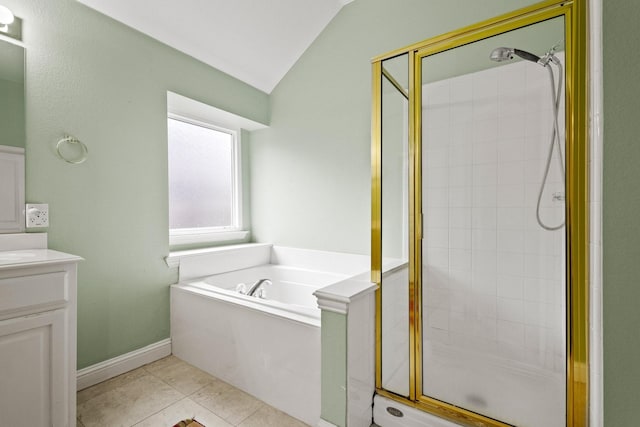 2009 Lake Fork Ct, Denton, TX 76210 - bathroom featuring a shower stall, a bath, vaulted ceiling, vanity, and tile patterned floors