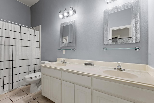 2009 Lake Fork Ct, Denton, TX 76210 - full bath with tile patterned flooring, double vanity, and a shower with curtain