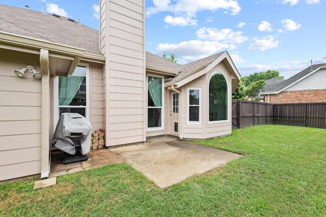 2009 Lake Fork Ct, Denton, TX 76210 - back of house with a fenced backyard, a chimney, a patio, and a shingled roof
