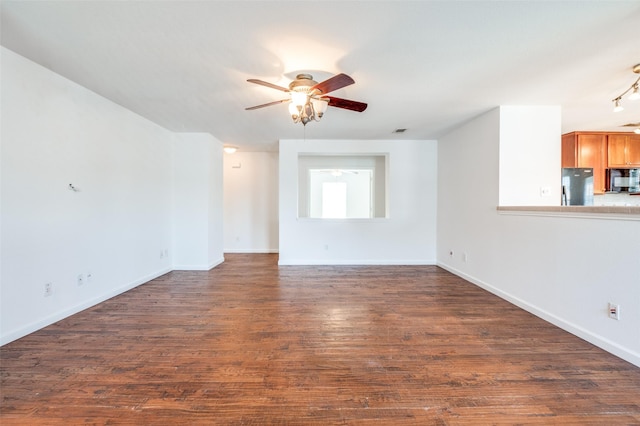 12430 Ridgetop Cir, Frisco, TX 75035 - unfurnished living room featuring ceiling fan and dark wood-type flooring