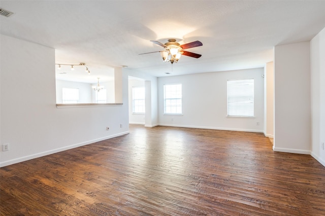 12430 Ridgetop Cir, Frisco, TX 75035 - spare room featuring ceiling fan, a chandelier, and dark wood-style flooring
