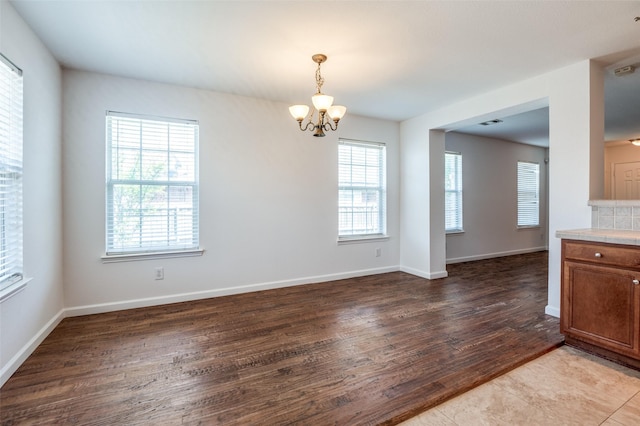 12430 Ridgetop Cir, Frisco, TX 75035 - empty room featuring a chandelier, healthy amount of natural light, and light wood finished floors