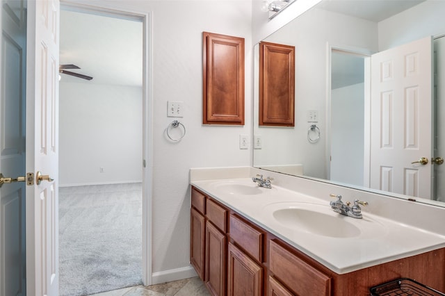 12430 Ridgetop Cir, Frisco, TX 75035 - full bathroom featuring double vanity and baseboards