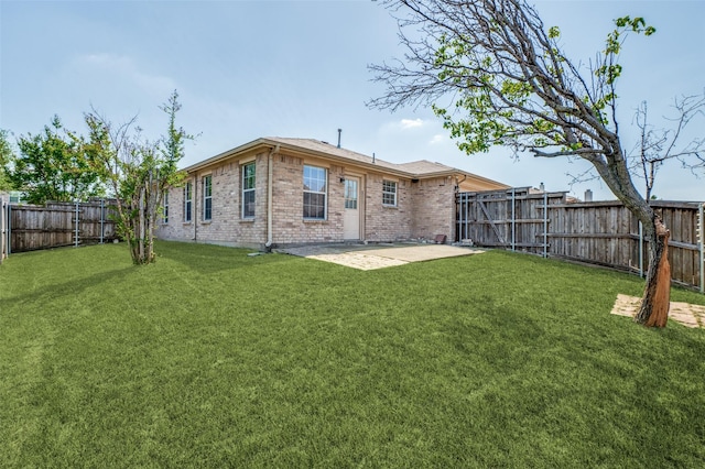 12430 Ridgetop Cir, Frisco, TX 75035 - rear view of house with a fenced backyard, brick siding, and a patio