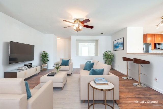 12430 Ridgetop Cir, Frisco, TX 75035 - living area featuring a ceiling fan and wood finished floors