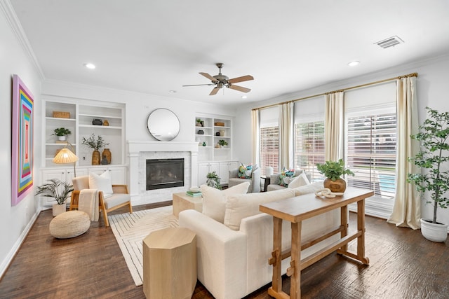6154 Vickery Blvd, Dallas, TX 75214 - living room featuring ceiling fan, crown molding, a fireplace, dark wood finished floors, and built in shelves