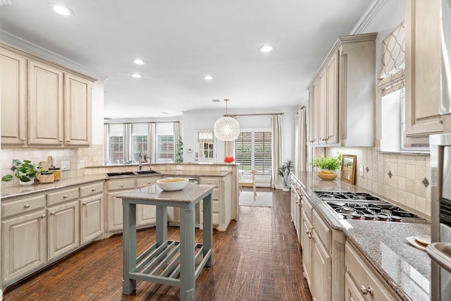 6154 Vickery Blvd, Dallas, TX 75214 - kitchen featuring a peninsula, cream cabinets, recessed lighting, tasteful backsplash, and stainless steel gas cooktop