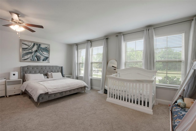 11504 Dawn Mist Dr, Frisco, TX 75035 - carpeted bedroom with baseboards and a ceiling fan