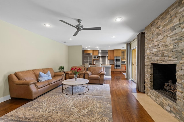 4247 Goodfellow Dr, Dallas, TX 75229 - living area featuring dark wood finished floors, ceiling fan, a fireplace, and recessed lighting