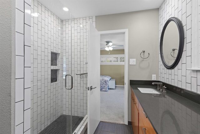 4247 Goodfellow Dr, Dallas, TX 75229 - ensuite bathroom with a stall shower, vanity, ceiling fan, recessed lighting, and wood finished floors