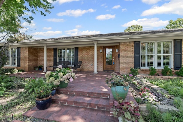 4247 Goodfellow Dr, Dallas, TX 75229 - entrance to property featuring brick siding and a porch