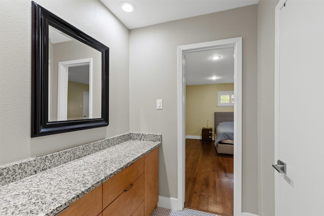 4247 Goodfellow Dr, Dallas, TX 75229 - ensuite bathroom featuring vanity, wood finished floors, and recessed lighting