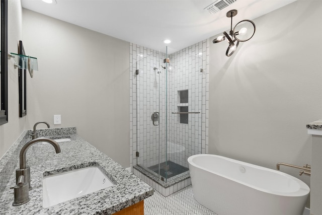 4247 Goodfellow Dr, Dallas, TX 75229 - full bath featuring double vanity, a stall shower, a freestanding bath, and recessed lighting