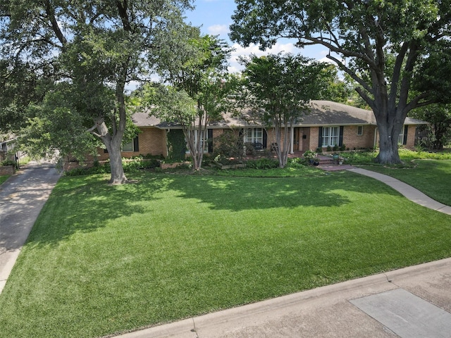 4247 Goodfellow Dr, Dallas, TX 75229 - ranch-style house with brick siding and a front yard