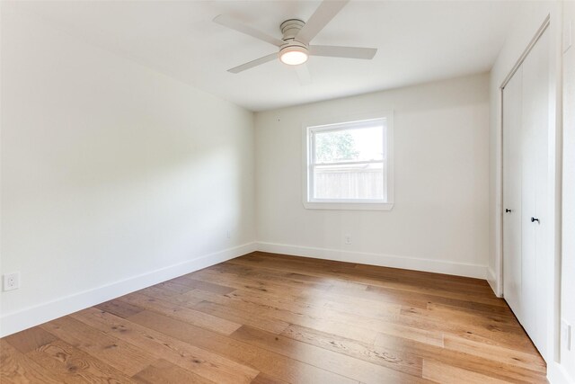 1508 N Waterview Dr, Richardson, TX 75080 - unfurnished bedroom with a closet, light wood-style floors, and a ceiling fan