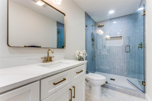 1508 N Waterview Dr, Richardson, TX 75080 - bathroom with vanity, marble look tiles, and a shower stall