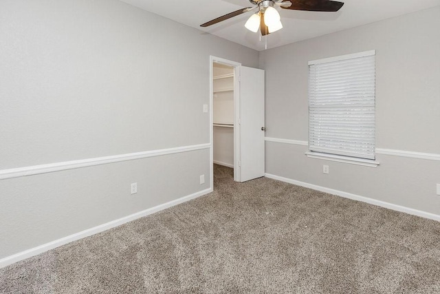 6119 Wall St, Arlington, TX 76018 - unfurnished bedroom featuring a spacious closet, carpet floors, a ceiling fan, and a closet
