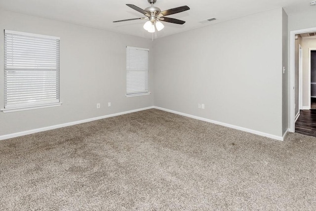 6119 Wall St, Arlington, TX 76018 - carpeted spare room featuring ceiling fan and baseboards