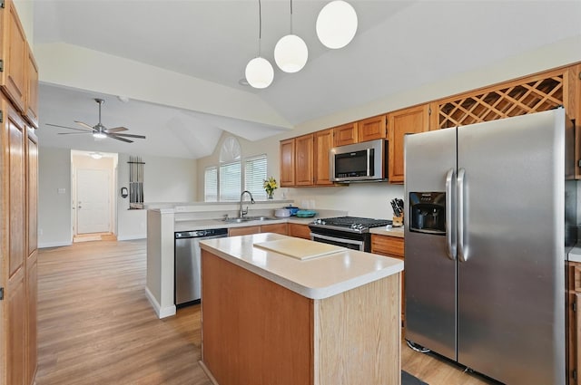 1801 Bent Brook Dr, Mesquite, TX 75181 - kitchen with appliances with stainless steel finishes, vaulted ceiling, a peninsula, light wood-type flooring, and light countertops