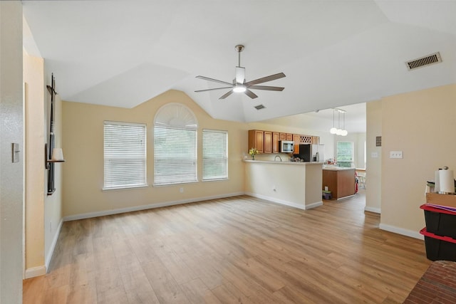 1801 Bent Brook Dr, Mesquite, TX 75181 - unfurnished living room with a ceiling fan, vaulted ceiling, and light wood-type flooring