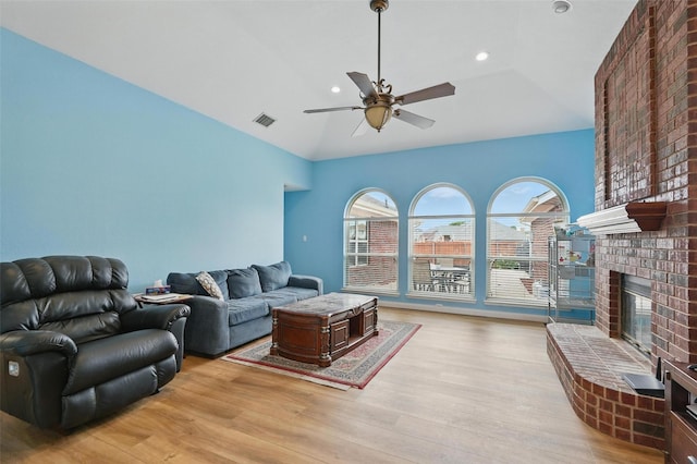 1801 Bent Brook Dr, Mesquite, TX 75181 - living room with ceiling fan, light wood finished floors, a fireplace, lofted ceiling, and recessed lighting