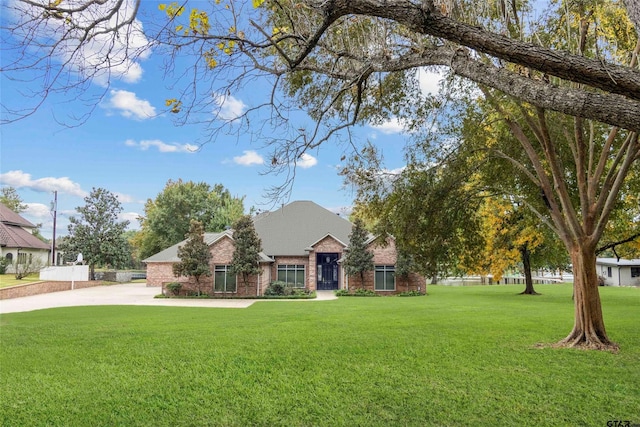13735 Peninsula Rd, Whitehouse, TX 75791 - view of front facade with brick siding, a front lawn, and a chimney