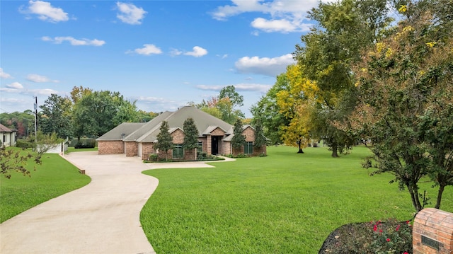 13735 Peninsula Rd, Whitehouse, TX 75791 - view of front of house with a front yard and concrete driveway
